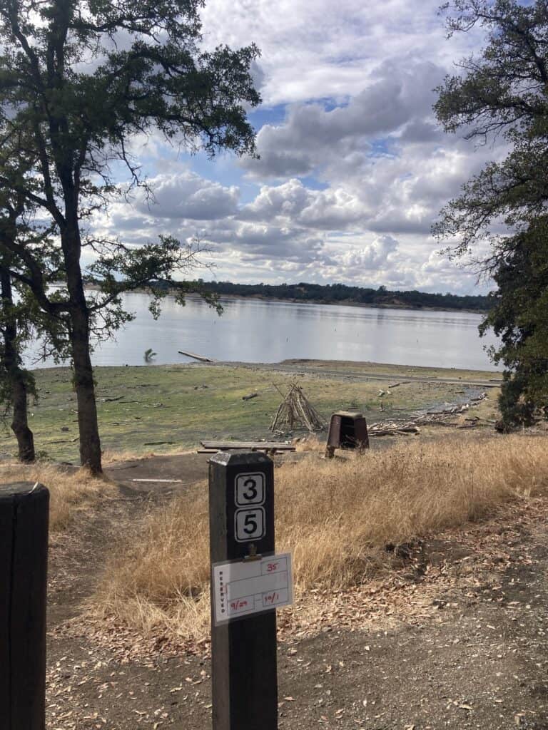 A view of the lake from campsite 35 with beautiful white clouds against the blue sky.