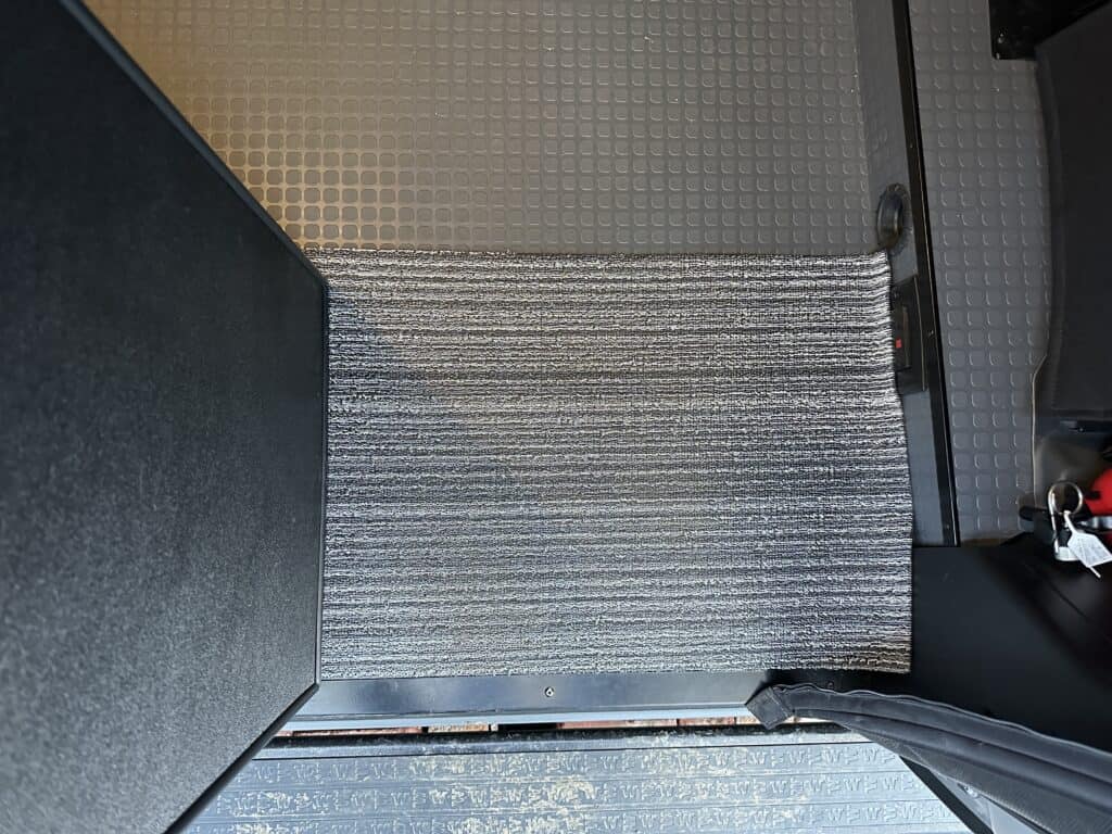 Top view of a Chiliwich floor mat in a van