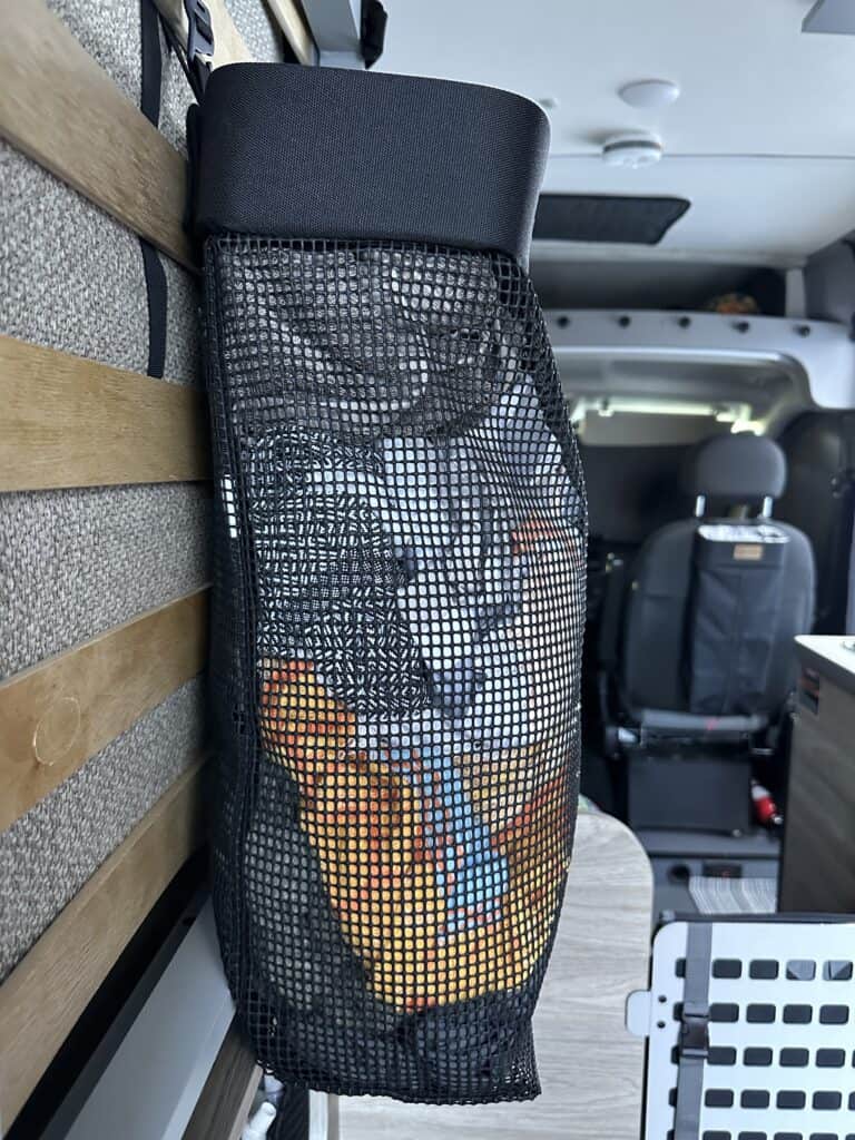 side view of the best compact laundry bag for van life by radius outfitters