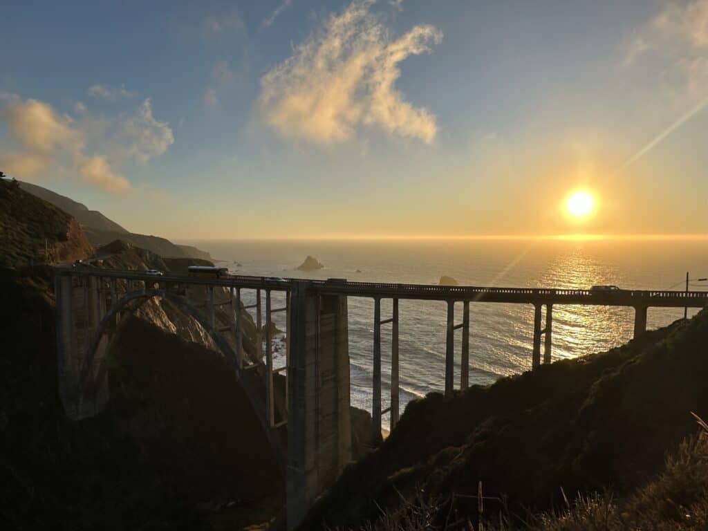 looking through the big sur bridge at the sunset