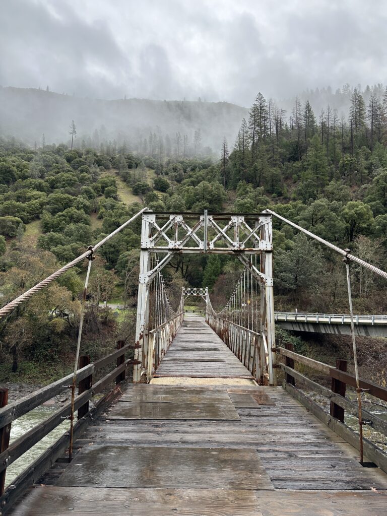 an old cable bridge going over the american river