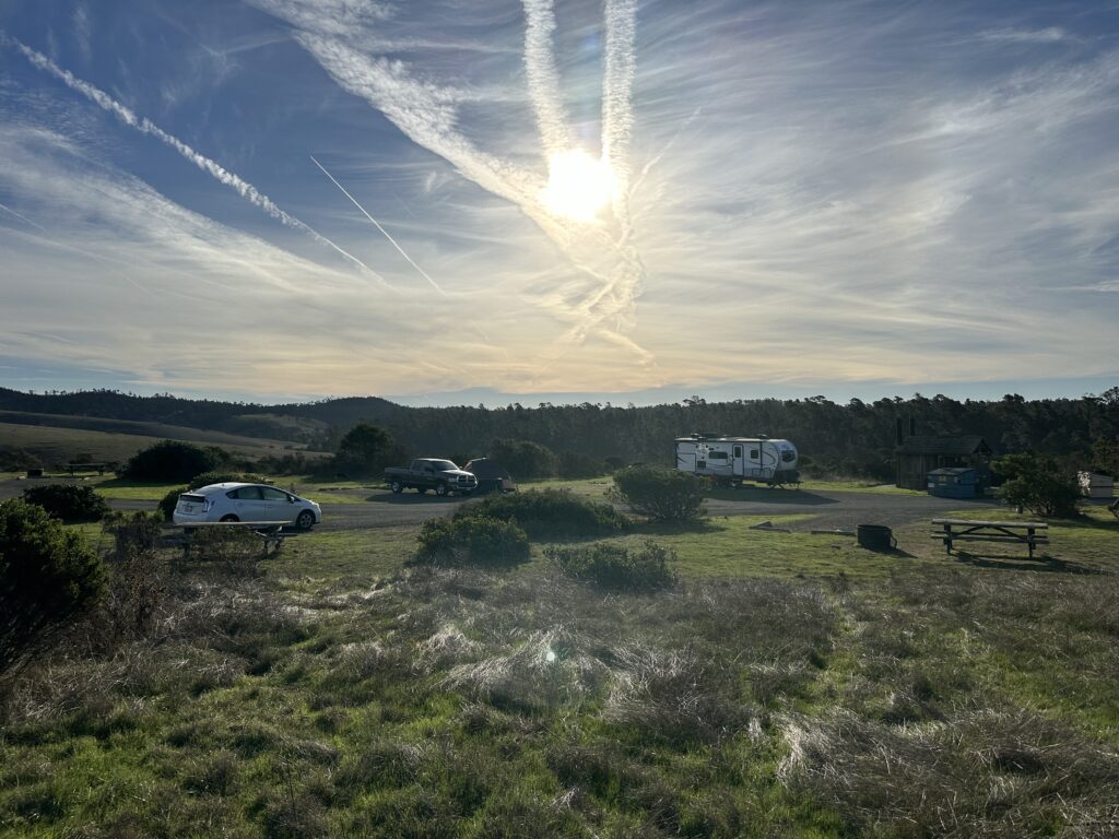 gray camper van in a campsite