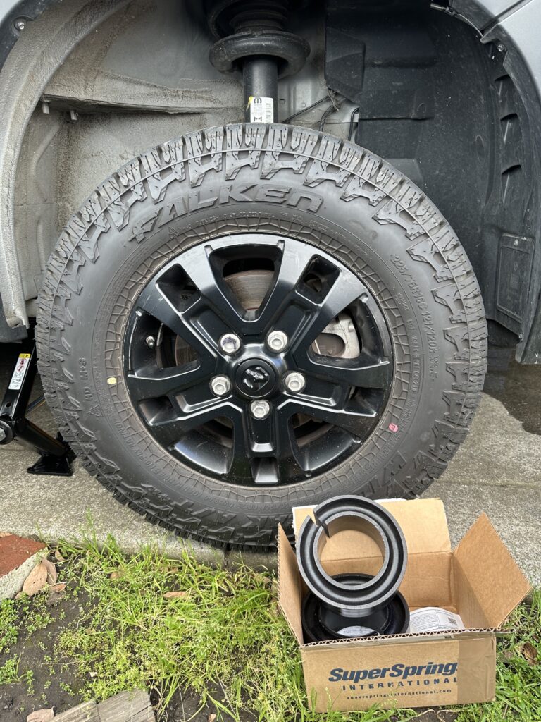 sumo springs in their open box in front of a van wheel