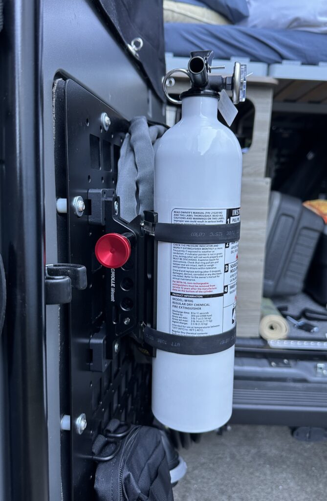 side view of the tacmolle extinguisher holder mount on a molle panel