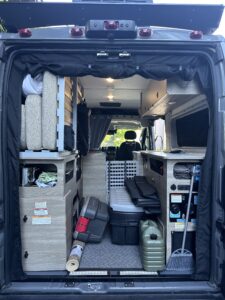 an open van essential rear door bug screen on a van