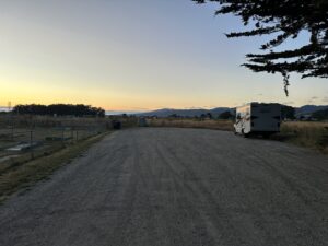 gravel parking lot with a class C motorhome on it