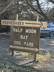 the sign to the half moon bay dog park