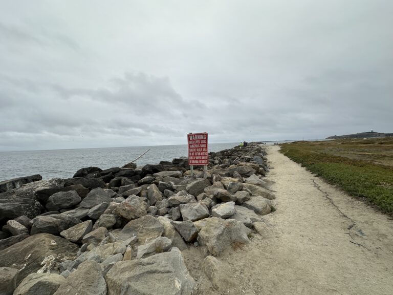 looking out along the jetty that protects the harbor