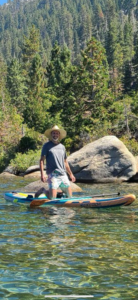 me kneeling on a paddle board